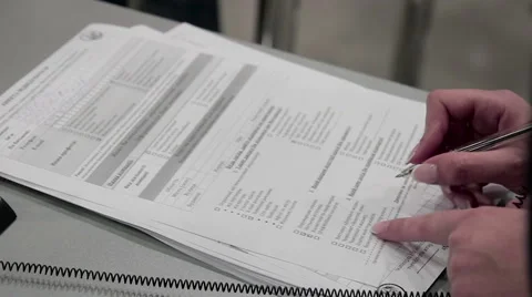 Women fill in a form questionnaire Видео 65746355