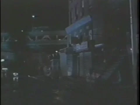 Women getting out of taxi and going to her apartment, New York City, 1980s Stock Footage