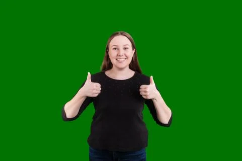 Women giving two thumbs up on green screen backdrop Stock Photos