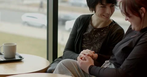 Women gracefully unwind while exploring peaceful cityscape at sunset Stock Footage 321030961