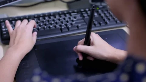 Women Graphic Designer working on a tablet Stock Footage 239019677