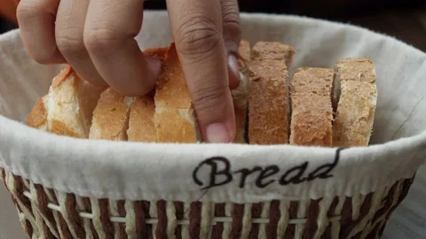 Women hand pick slice of a bread 스톡 동영상 236533974