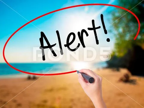 Women Hand writing Alert! with black marker on visual screen Stock Photos