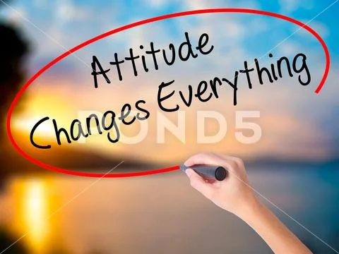 Women Hand writing Attitude Changes Everything with black marker Stock Photos