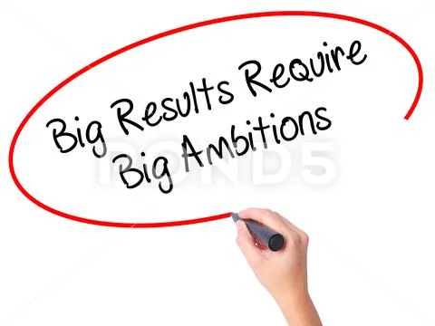 Women Hand writing Big Results Require Big Ambitions with black Stock Photos