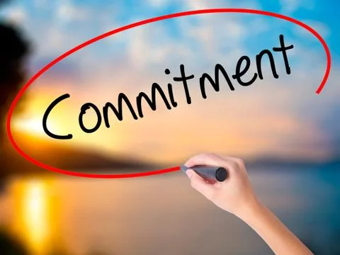 Women Hand writing Commitment with black marker on visual screen Stock Photos