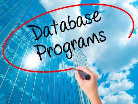 Women Hand writing Database Programs with black marker on visual screen. Stockfoto's