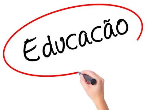 Women Hand writing Education (Educacao in Portuguese) with black marker on vi Stock Photos