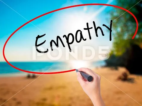 Women Hand writing Empathy with black marker on visual screen Stock Photos