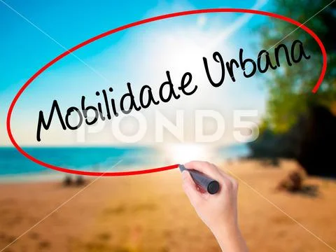 Women Hand writing Mobilidade Urbana (Urban Mobility in Portugue Stock Photos