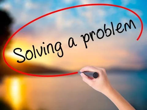 Women Hand writing Solving a problem with black marker on visual Foto stock
