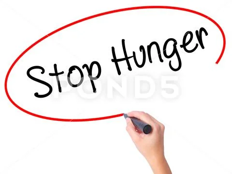 Women Hand writing Stop Hunger with black marker on visual scre Stock Photos