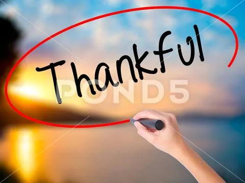 Women Hand writing Thankful with black marker on visual screen Stock Photos