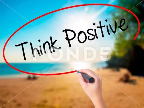 Women Hand writing Think Positive with black marker on visual sc Stock Photos
