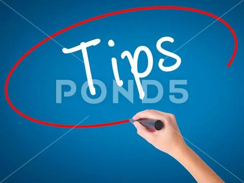 Women Hand writing Tips with black marker on visual screen Stock Photos