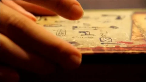 Women hands exploring an old book and finding something important Stock Footage 77862267