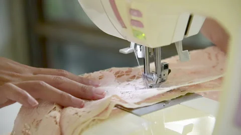 Women hands tailor sewing machine. Young fashion designer hands using sew machin Video stock 229676779