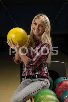 Women holding a bowling ball Stock Photos