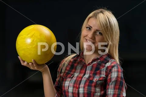 Women holding a bowling ball Stock Photos