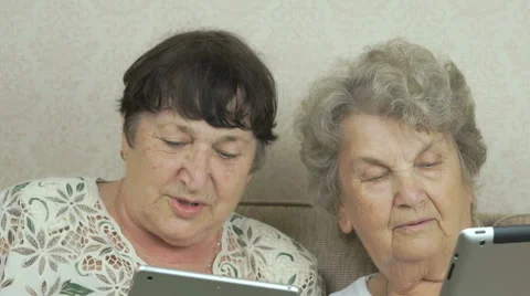 Women holding the silver digital tablets Stock Footage 66204553