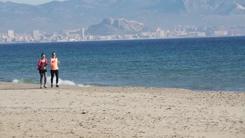 Women jogging on the beach. nice background Stock Footage 89700372