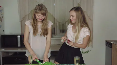 Women on a Kitchen and Talking drinking champagne smiling dance rapid 50fps Stock Footage 68183254