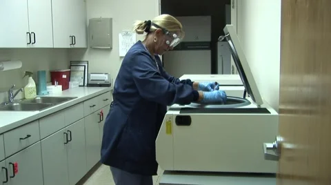 Women in Lab Using Centrifuge Stock Footage 48333262