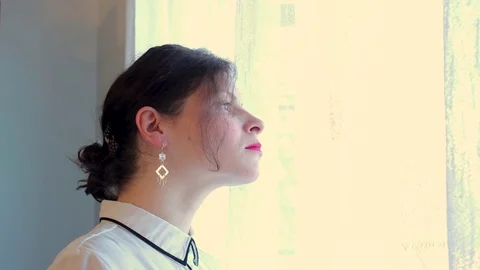 Women looking through the window  Stock-Footage 82546758