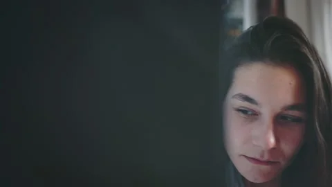 Women neighbors at quarrel eavesdropping through room wall using glass cup Stock Footage