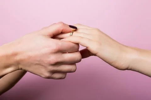 Women Partners Exchanging Rings in Engagement for St. Valentine Stock Photos