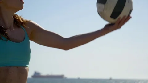 Women players play beach volleyball and a player serves the ball, super slow mot Stock Footage