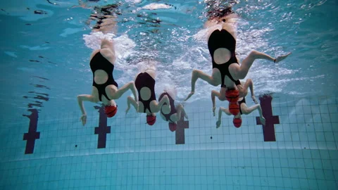 Women in the pool practicing Synchronized Swimming upside down Stock Footage 283102627