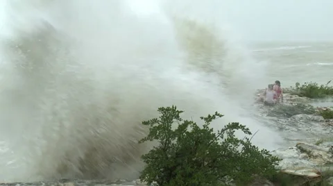 Women Pounded By Huge Storm Waves Stock Footage