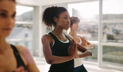 Women practices yoga in class Stock Photos