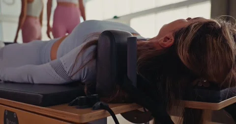 Women Practicing Pilates in Modern Studio Setting 스톡 동영상 323937006