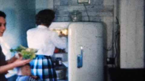 Women prepare dinner at family reunion 1950s vintage film home movie 4933 Stock Footage