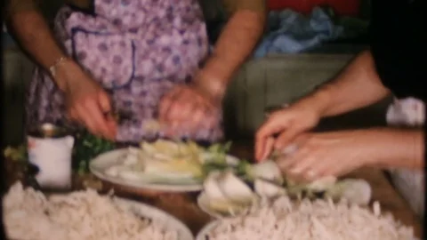 Women prepare the family dinner in the kitchen  1950s vintage home movie  4023 Stock Footage