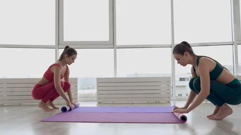 Women preparing exercise mat for the training. Stock Footage 118965208
