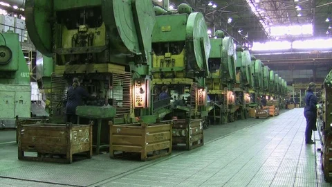 Women puts component under press machine AutoVAZ factory Stock Footage 71833796