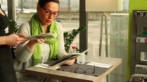 Women in the restaurant ordering the dinner Stock Footage 70998051