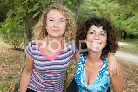 Women running exercising jogging happy training as part healthy lifestyle. Stock Photos