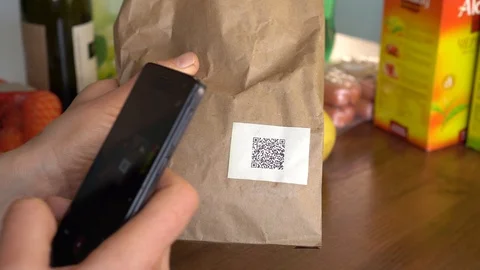 A women scanning a QR code on food packa... | Stock Video | Pond5