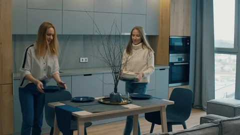 Women Setting Dinner Table at Home Stock Footage 101365836