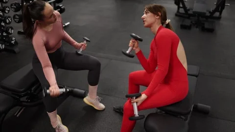 Women share concerns during workout Stock Footage 337114403