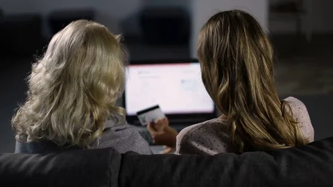 Women shopping online with credit card at home Stock Footage