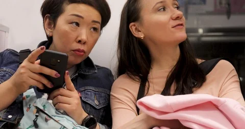 Women talking while sitting on train Stock-Footage 120666679