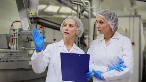 Women technologists at ice cream factory Stock Footage