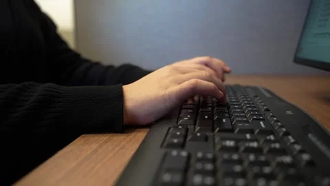 Women typing at computers in an office environment Stock Footage 341981307
