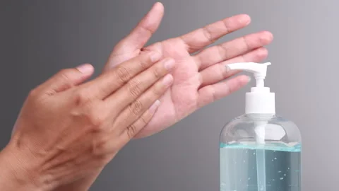 Women using hand sanitizer alcohol gel washing hand to prevent Coronavirus. Stock Footage