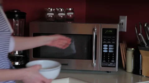 Women using microwave Stock Footage 46200895